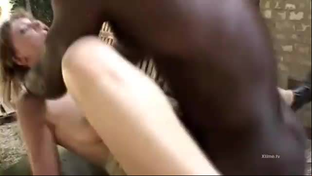 A cute blonde wild fucked by a black cock in a barn